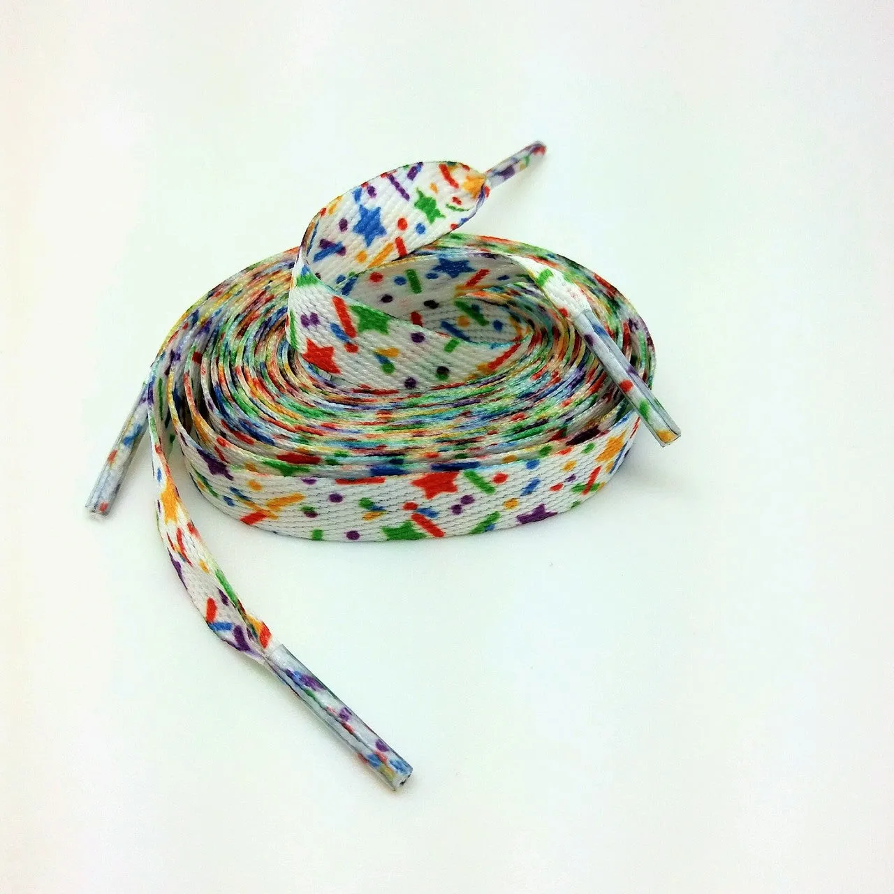 Shoelaces with sprinkles in primary colors printed on standard shoelace material 54" long